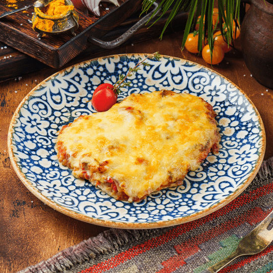Мясо по французски с сыром и томатами — Ресторан Халиф